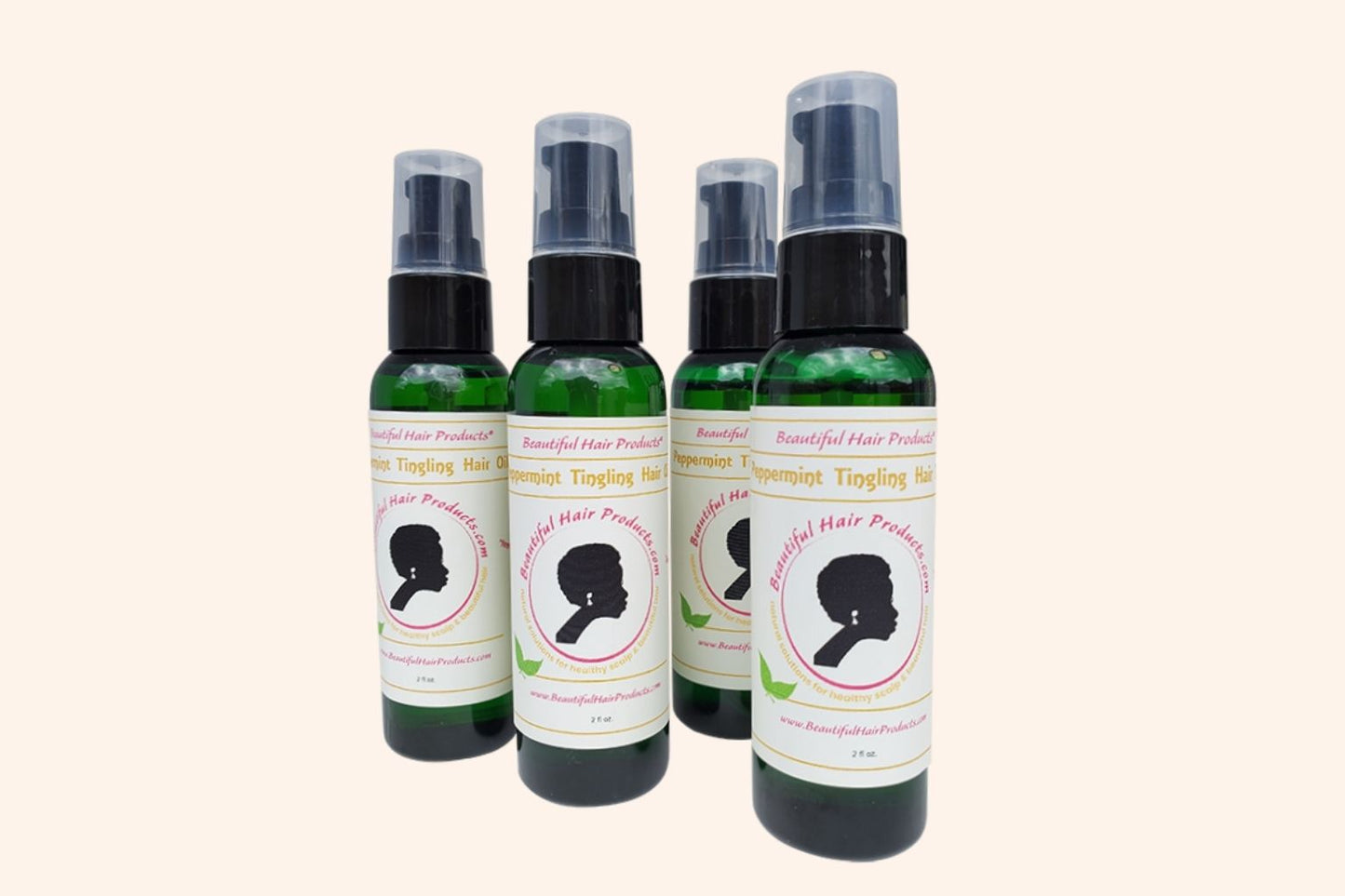 Four bottles of Peppermint Hair Growth Oil 2oz bottle with green and cream label for stimulating scalp treatment