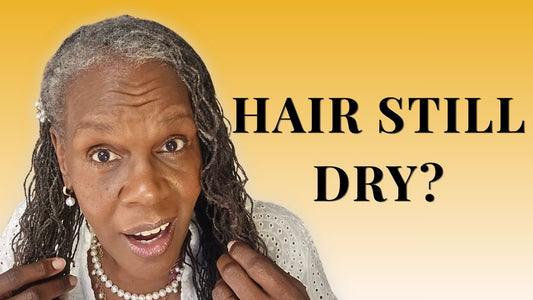 Mature Black woman with healthy Sisterlocks learning how to rotate hair products for moisture, scalp balance, and softer Sisterlocks.
