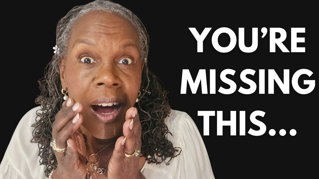 Mid-aged Black woman with salt-and-pepper Sisterlocks shopping for fresh fruits and vegetables in a grocery store, representing nutrition for healthy hair growth.