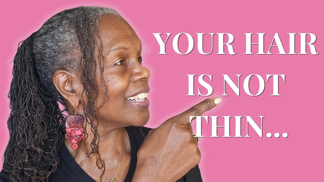 Mid-aged Black woman with salt-and-pepper Sisterlocks in a grocery store selecting fresh produce, representing healthy hair from within
