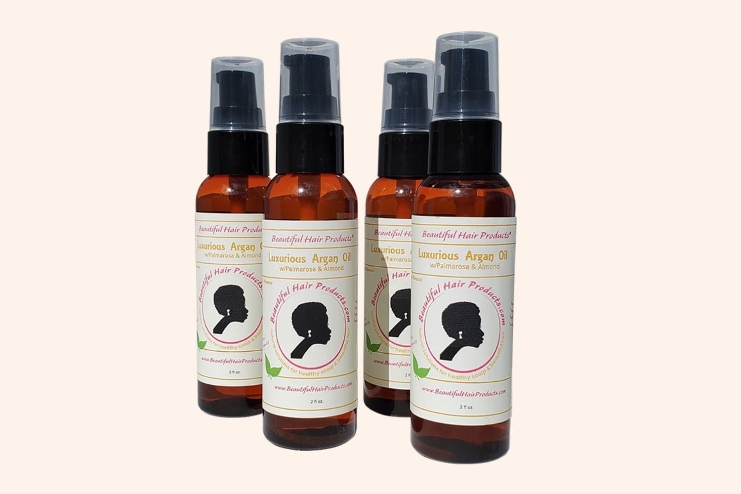  4 bottles of Argan Scalp Renewal Growth Oil 2oz bottle with gold and cream label for pure argan oil hair growth treatment