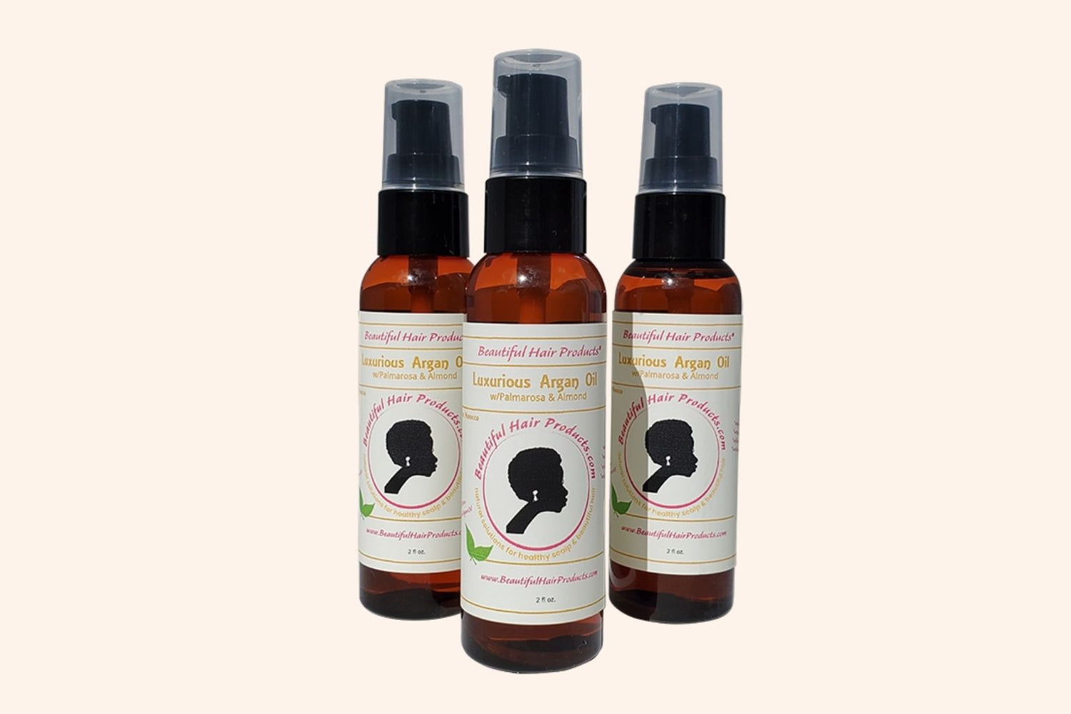 3 bottles of Argan Scalp Renewal Growth Oil 2oz bottle with gold and cream label for pure argan oil hair growth treatment
