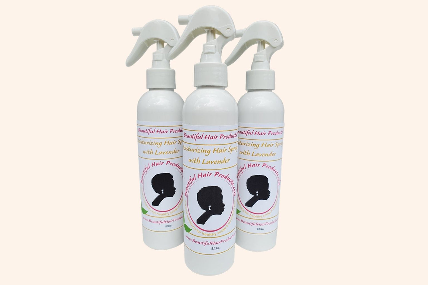 Three bottles of Lavender Daily Moisture Mist bottle, 8oz with purple and cream label featuring lavender for Sisterlocks therapeutic care