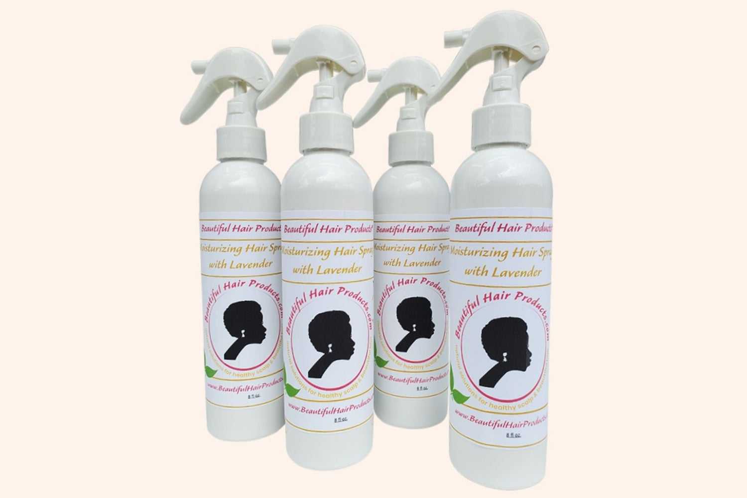 Four bottles of Lavender Daily Moisture Mist bottle, 8oz with purple and cream label featuring lavender for Sisterlocks therapeutic care