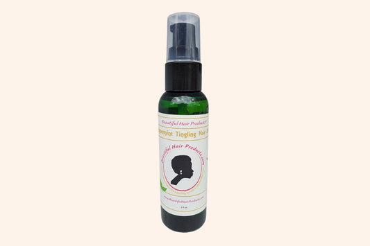 Peppermint Hair Growth Oil 2oz bottle with green and cream label for stimulating scalp treatment