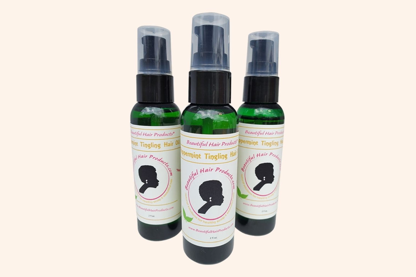 Three bottles of Peppermint Hair Growth Oil 2oz bottle with green and cream label for stimulating scalp treatment