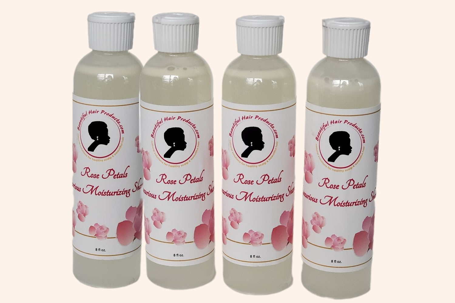 Four bottles of Rose Petals Sulfate-Free Shampoo 8oz bottle with pink and cream label for gentle medium porosity hair cleansing