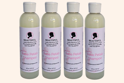 Four bottles of Rose Petals Sulfate-Free Shampoo for Sisterlocks and medium-porosity hair.