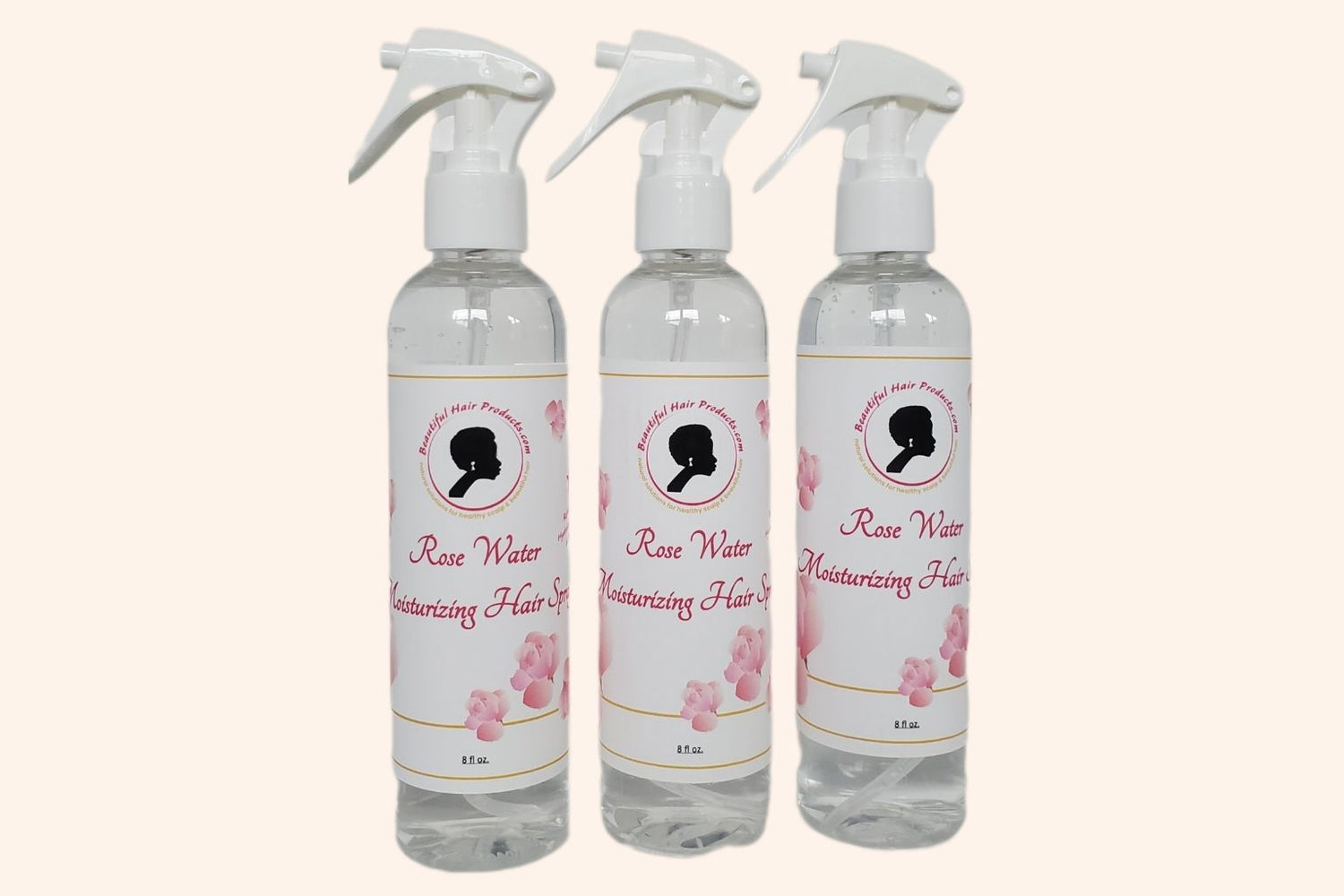 Three bottles of Rose Water Hydrating Spray 8oz bottle with pink and cream label for daily moisture mist for medium porosity hair