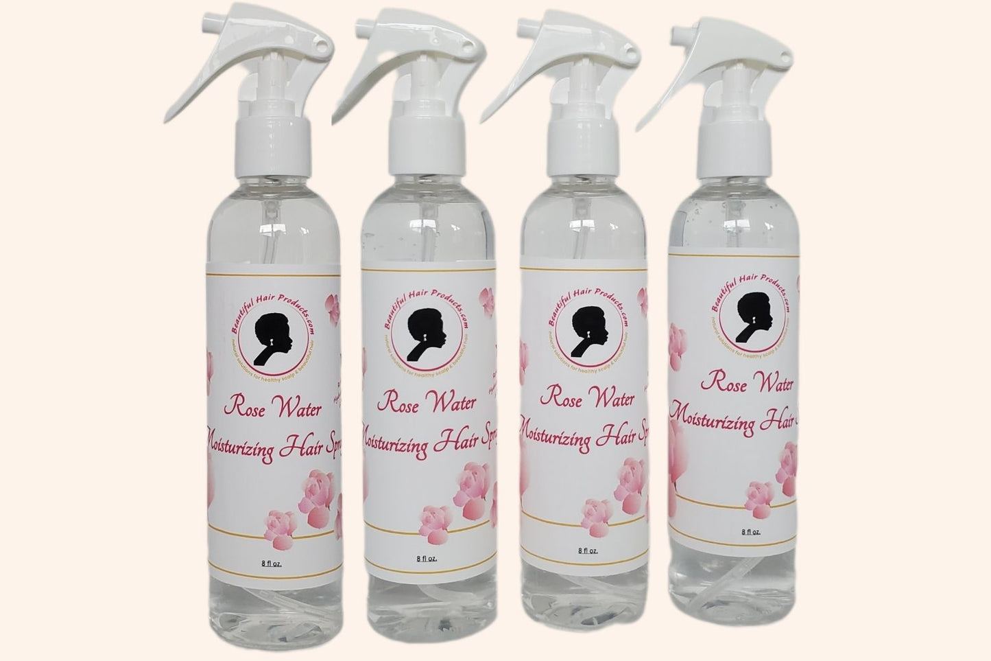 Four bottles of Rose Water Hydrating Spray 8oz bottle with pink and cream label for daily moisture mist for medium porosity hair