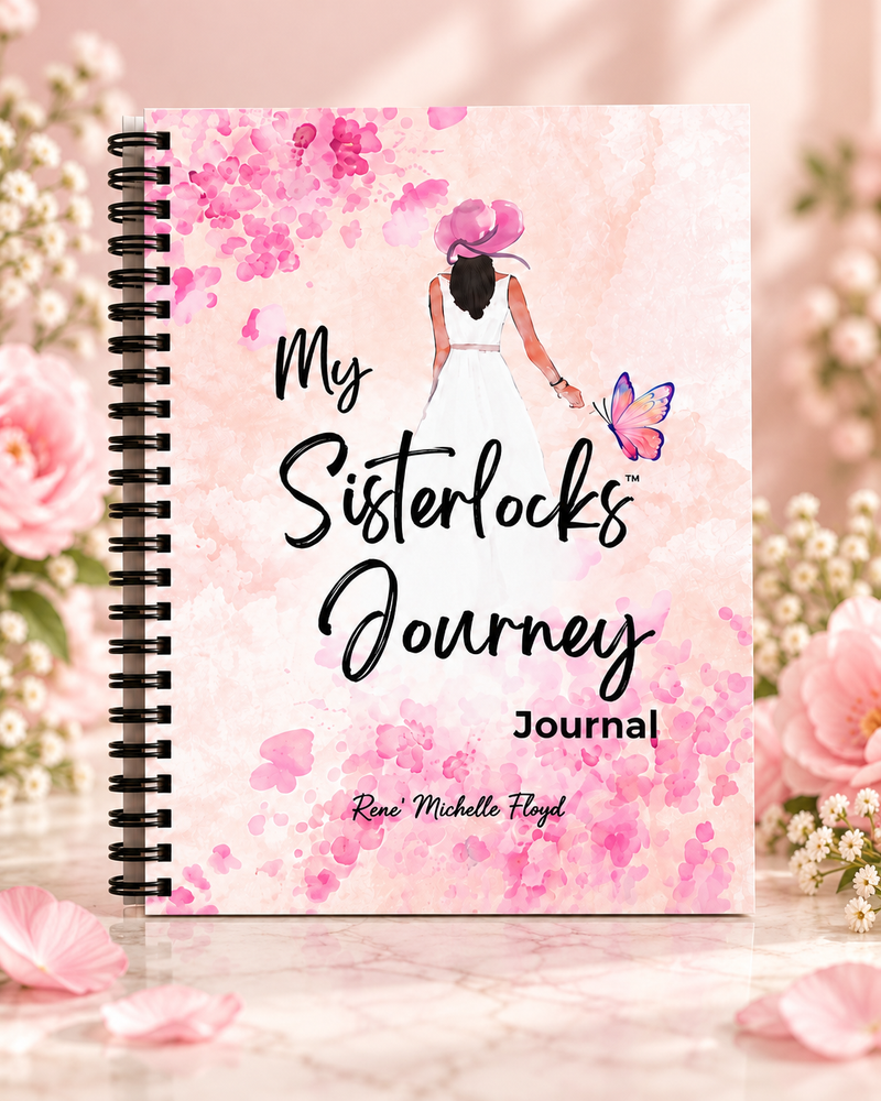 My Sisterlocks Journey Journal spiral-bound cover displayed upright in a soft pink floral setting.